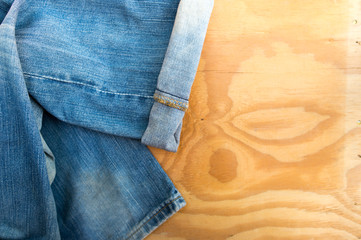 Jeans on the wooden floor.