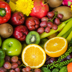 Closeup orange slice with Group of fresh fruits and vegetables