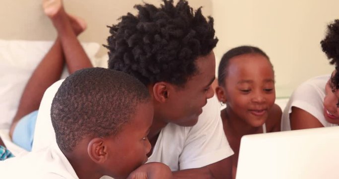 Happy family watching computer 