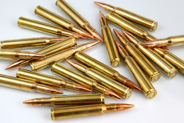 rifle cartridges on a white background