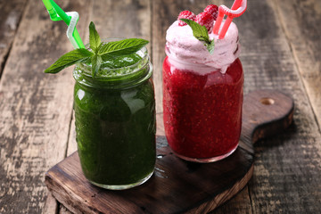 Healthy green fresh fruit and vegetable juice green and pink smoothie