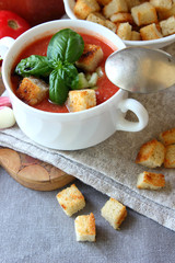 A plate of gazpacho with croutons..