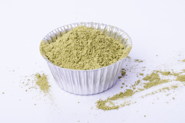 greentea powder. greentea powder on bakery cup  isolated on whit