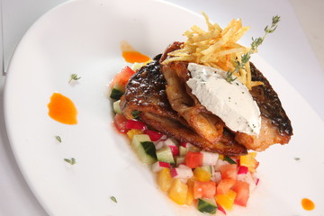fried fish on vegetables
