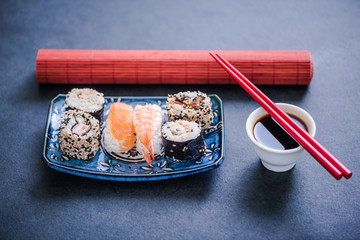 authentic sushi on dark slate