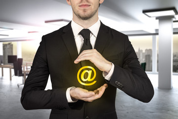 businessman protecting at sign in modern office