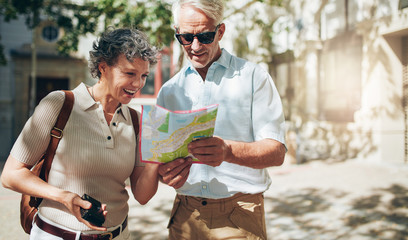 Senior couple reading a tourist map