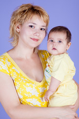 Mama embraces his cute daughter