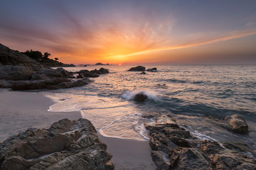 Fototapeta premium Beautiful sunset over coast and L'Ile Rousse in Balagne region o