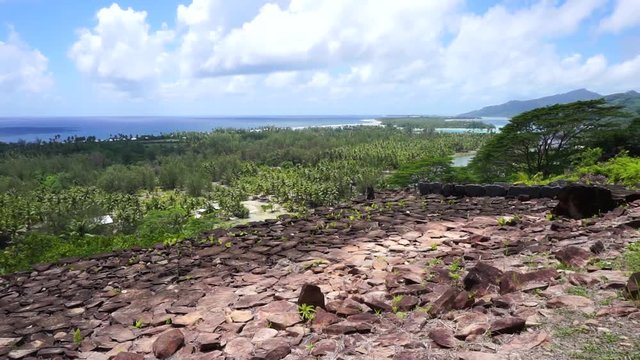 Viewpoint from a ancient stone structure, the marae Paepae Ofata, panning shot, Maeva, Huahine island, French Polynesia
