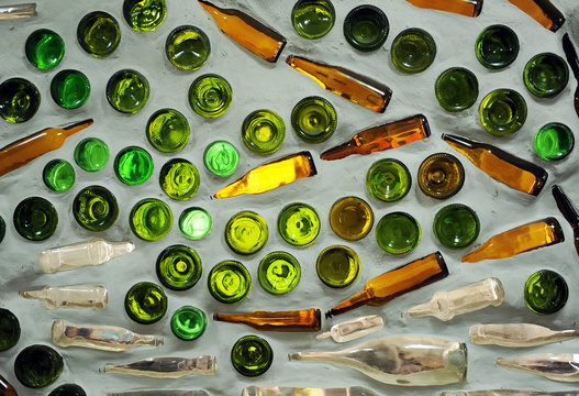 Wall decorated with glass bottles, interior design