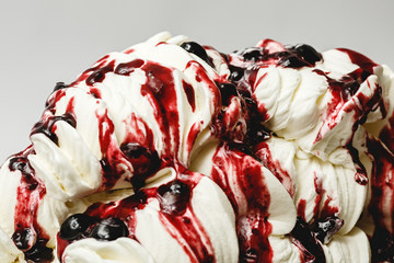 Cherry ice cream in the metal tray on white background