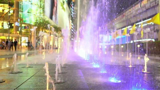 Fountain on the skyscraper. front focuses selectively. handheld camera.