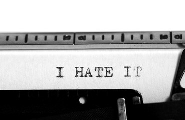 Typewriter. Typing text: i hate it