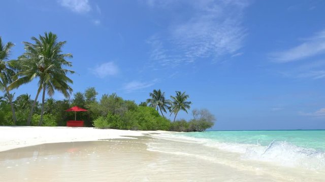 Empty daybed in exotic white sand lagoon