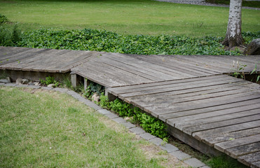 Fototapeta premium Wooden bridge in a forest along the trekking path