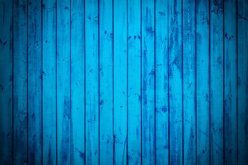 Fototapeta na wymiar Blue long planks. Texture of wood with vignette.