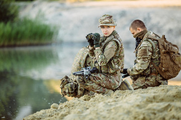 Special forces soldiers with weapon take part in military maneuv