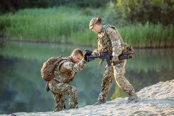 rangers during the military operation. soldiers climbing on mountain