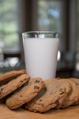Cookies Bend Around Glass of Milk