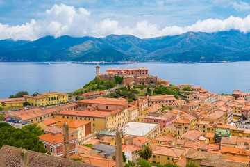 Fototapeta na wymiar Aerial view over Falcone fort and the lighthouse in Portoferraio town of Elba. 