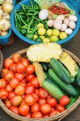 Asian street market selling tomato cucumber and eggs in Vietnam