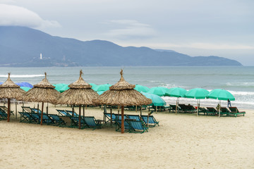Shelters and sunbeds on China Beach in Da Nang
