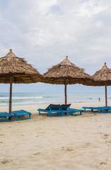 Shelter and sunbeds in China Beach in Da Nang