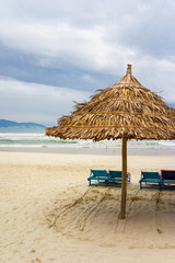 Sun beds and Palm shelter at China Beach