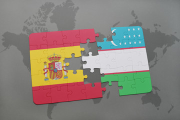 puzzle with the national flag of spain and uzbekistan on a world map background.