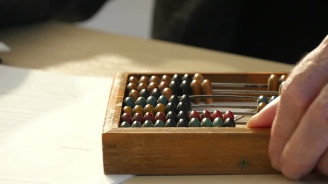 man said on the old wooden abacus