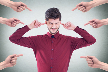 Mobbing concept with portrait of a young employee with many arms