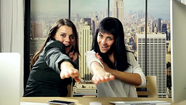 Business women making karate movement in office success concept