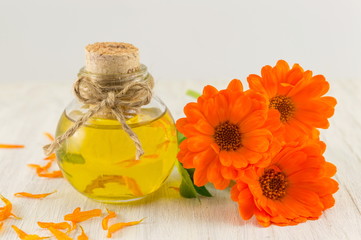 marigold oil with a fresh flower bouquet