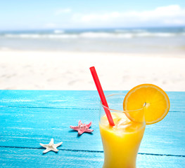 orange juice at the beach