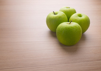 Apples with tape measure on blue wood background, lose weight concept