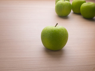 Apples with tape measure on blue wood background, lose weight concept