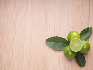Lime on wood background, Top view