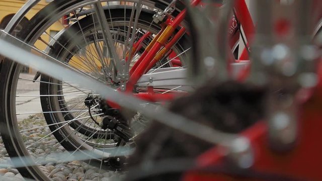 Bikes in a rack, focus shift on bike gears
