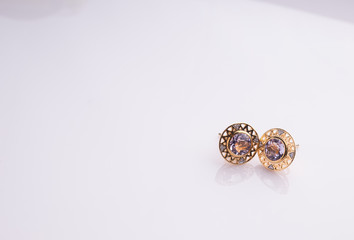 Jewel earring on white shine table