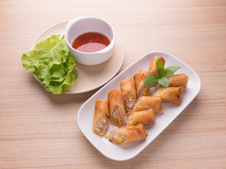 Crispy golden fried vegetable spring rolls,Chinese Traditional Spring rolls food on wood table