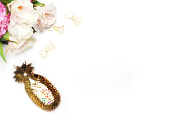 Flower on the table. Keyboard and stapler. Home workplace. Table view. Business accessories. Mock-up background.Peonies