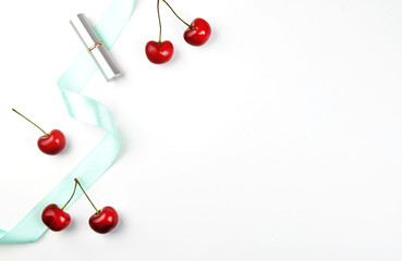 Naklejka na ściany i meble White table with things on the table : cherry and mint ribbon. Flat lay