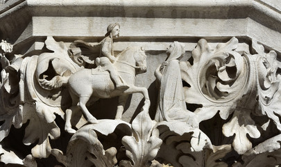 Medieval scene with cavalier and lady, from Doge palace ancient capital, in St Mark Square, Venice 