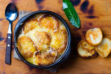 Onion soup with dried bread and cheese. Top view