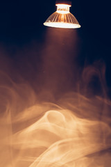 halogen lamp with reflector, warm spotlight in smoke