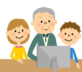 孫とパソコンに向かう高齢者