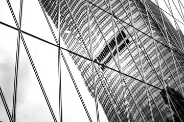 windows of business building on black and white color
