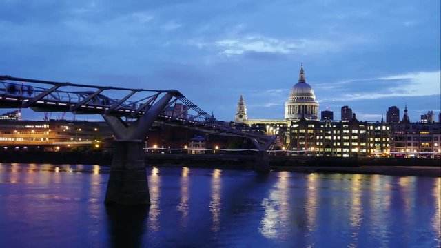 Timelapse of Millennium Bridge leading to Saint Paul's Cathedral during sunset in central London, UK
