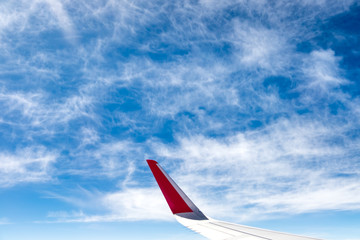 Fototapeta premium Aerial view of cloud and sky with airplane wing from airplane wi